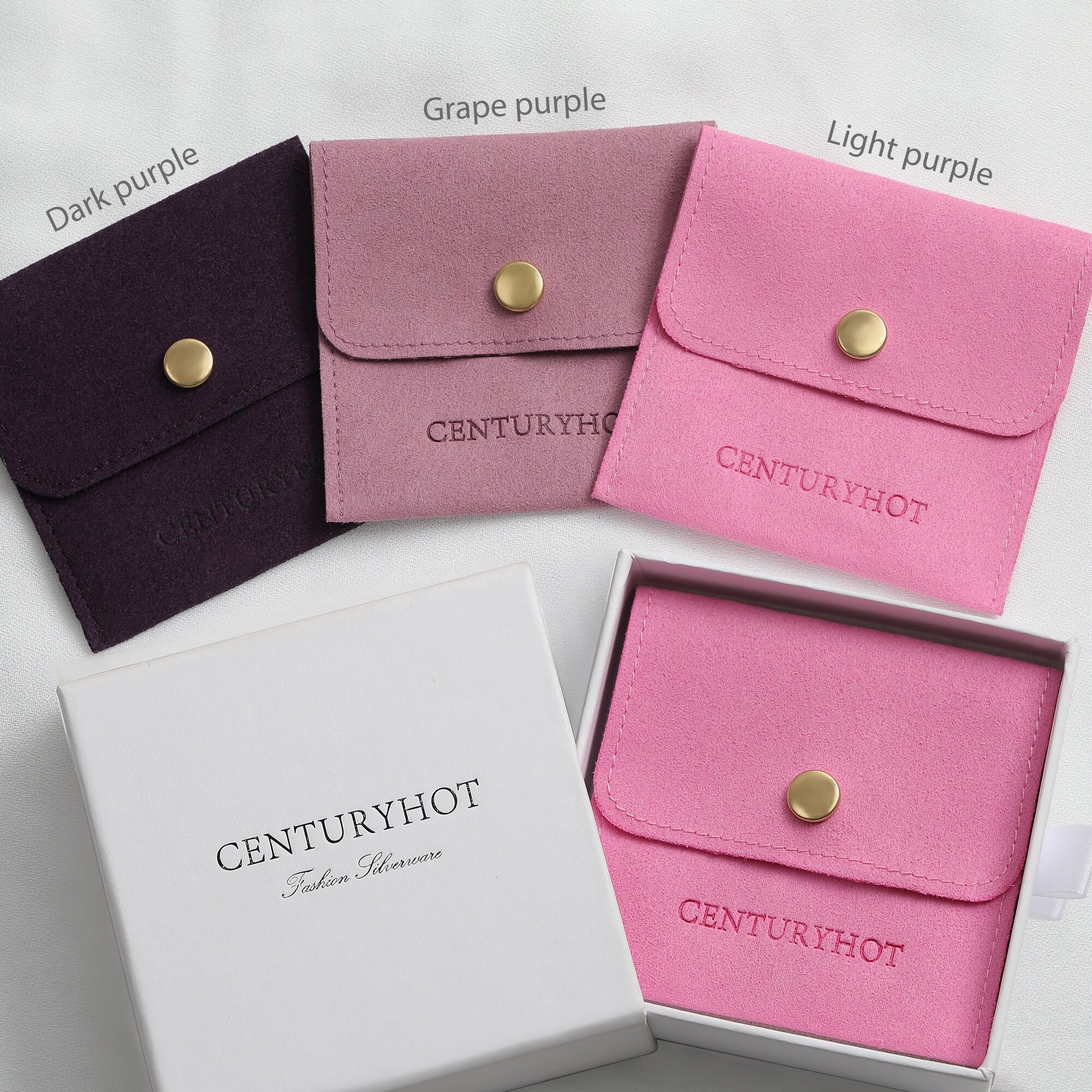 Custom logo purple earring bags with embossed branding, suitable for small jewelry brand packaging
