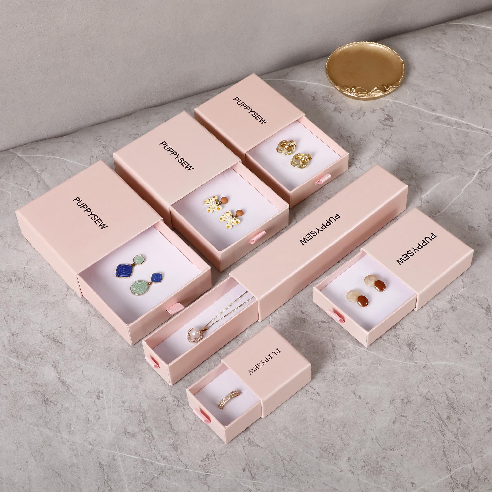 Textured cardboard white jewelry box with secure closure, ensuring wedding jewelry protection during gifting