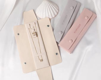 Organizador de joyas de microfibra con logotipo personalizado, estuche de viaje plegable para collares y anillos.