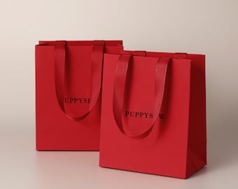 Bolsas de regalo de papel rojo con logotipo personalizado / Acabado mate, asas satinadas, embalaje para venta al por menor