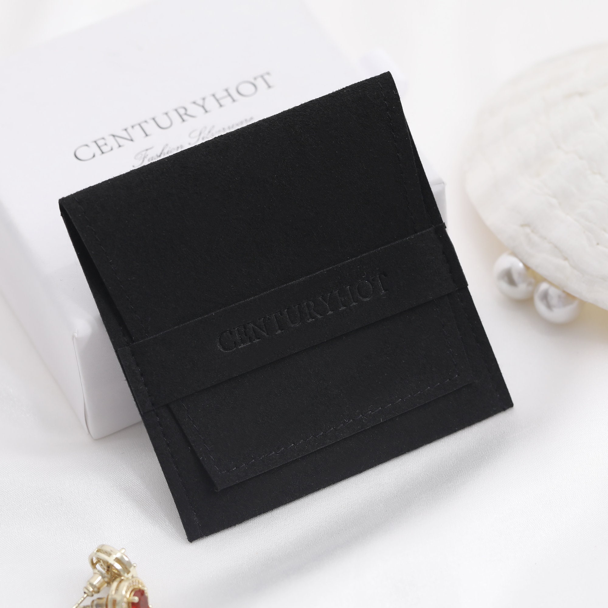 Small jewelry brands reduce inventory waste with 50pcs MOQ black microfiber jewelry bags, cutting upfront costs by 50% – from product introduction