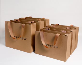 Bolsas de papel kraft personalizadas con logotipo, embalaje para regalos de boutique
