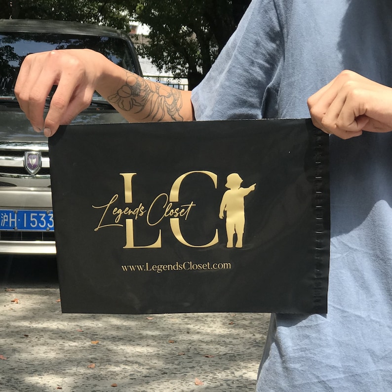 May include: Black mailing bag with gold lettering that reads "LC Legends Closet" and a website address "www.LegendsCloset.com". A small silhouette of a child is also included in the design.