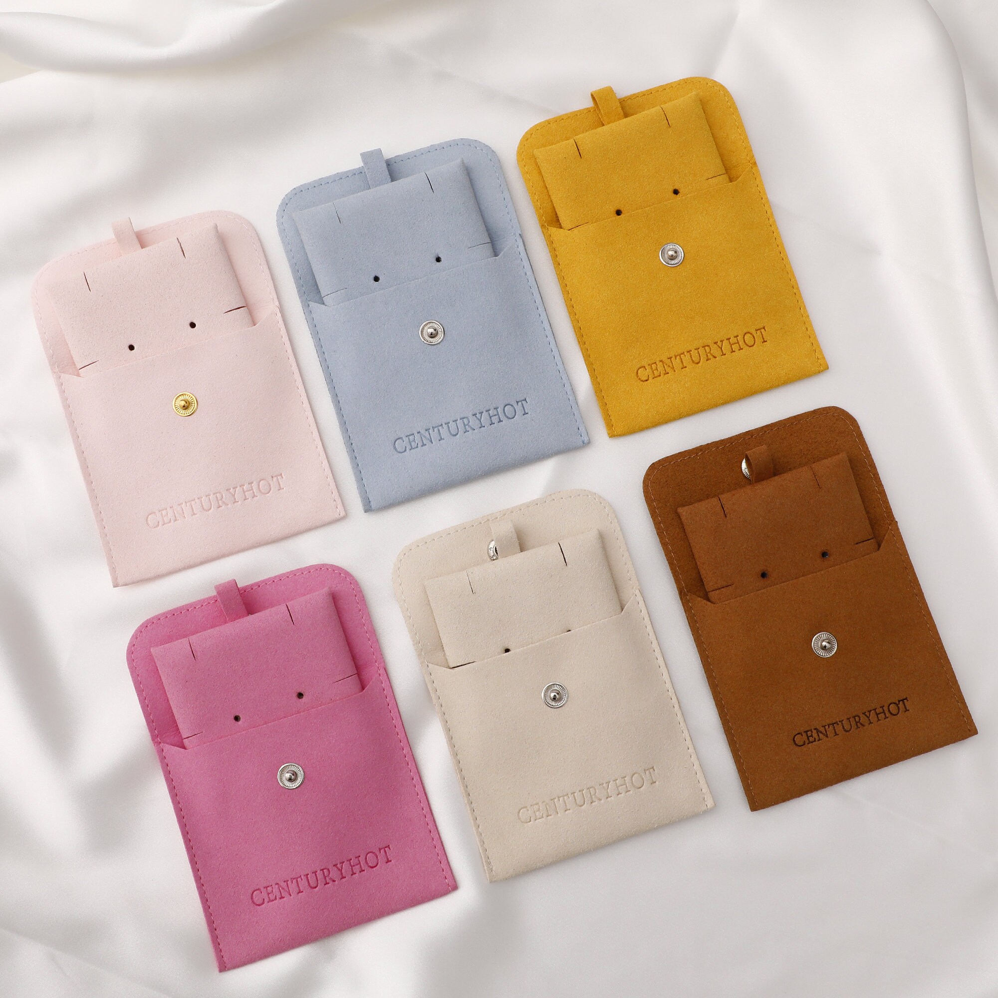 Custom logo microfiber envelope bag with embossed branding, enhancing small jewelry brand visibility