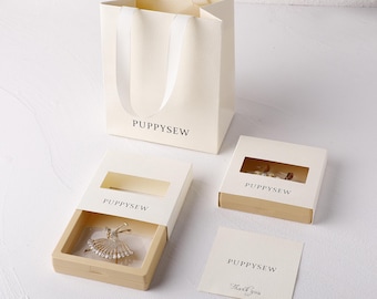 Juego de empaques para joyería con logotipo personalizado / Caja flotante de PE, bolsa de regalo, tarjeta (50 juegos)