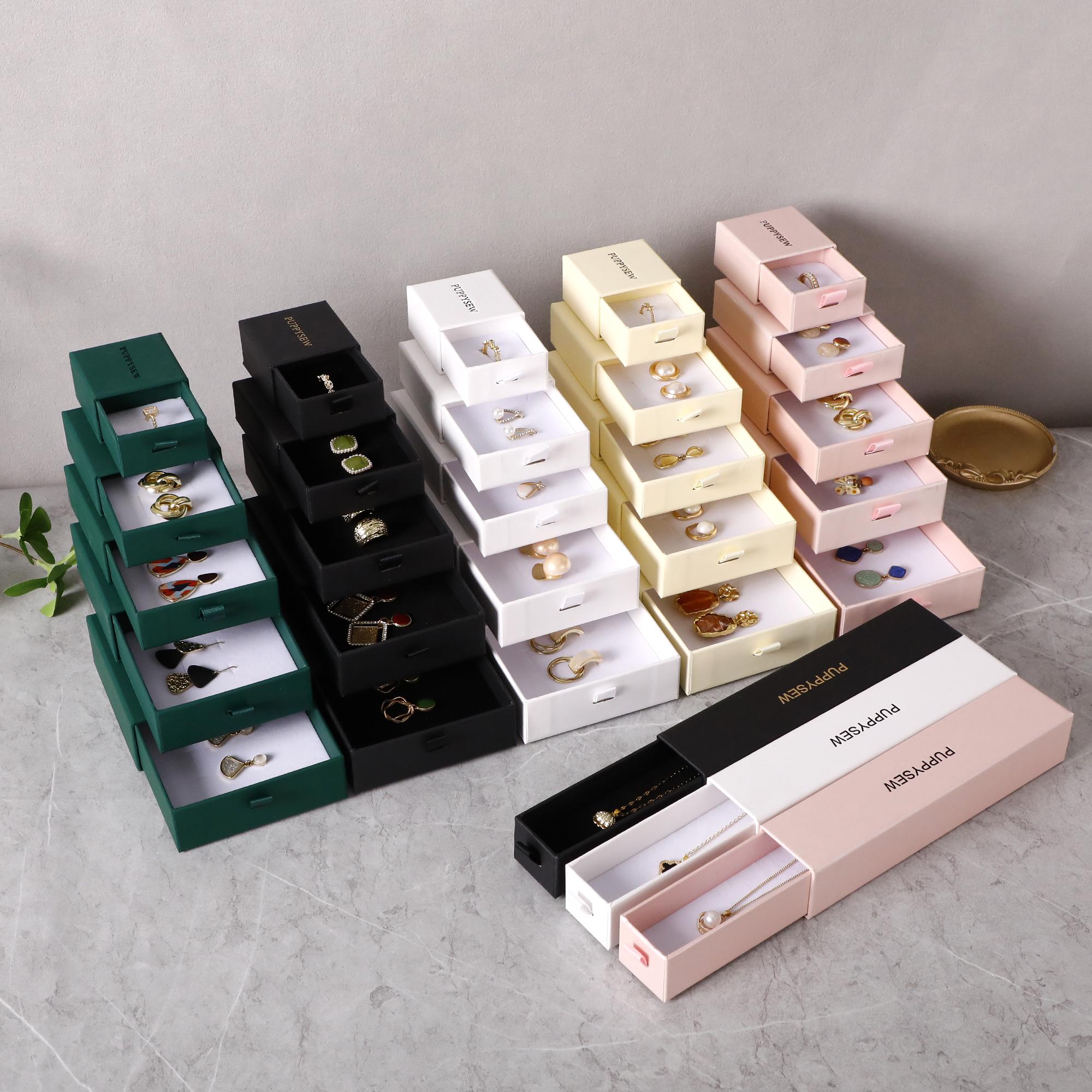 White wedding jewelry box with custom logo, ideal for branding wedding favors and small jewelry brand presentation