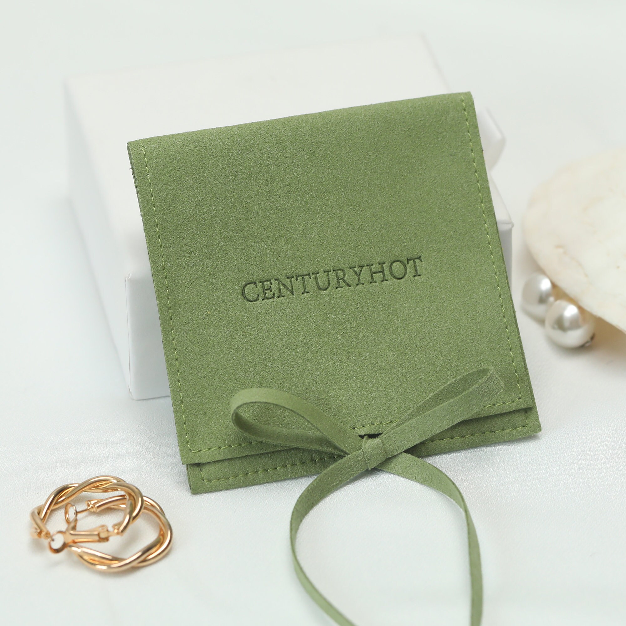 Small jewelry brands solve unnoticeable packaging with 50pcs custom print grass green bags—vibrant color and logo make customers notice (from product introduction)