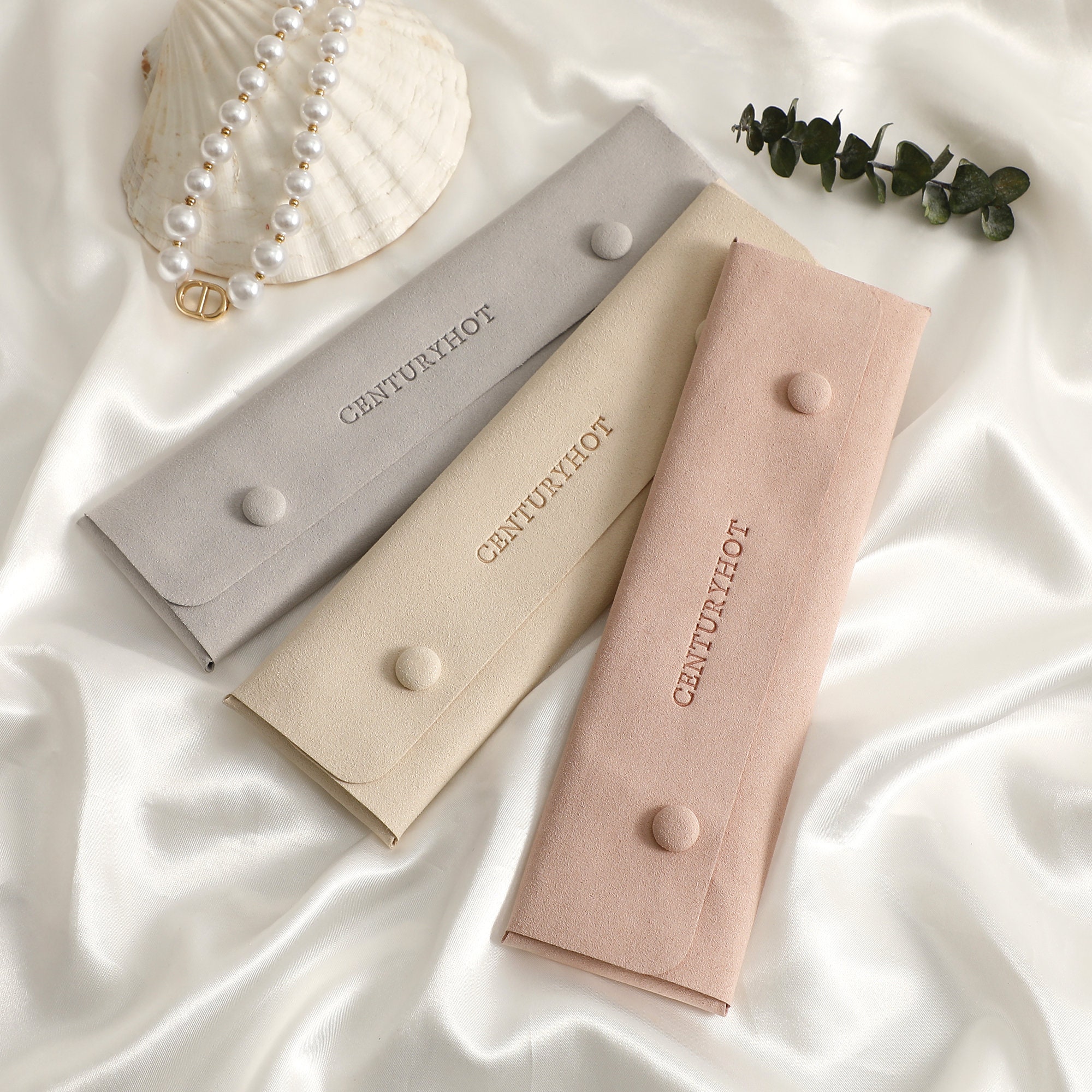 Large ivory microfiber bag with custom logo detail, showcasing branding options for jewelry packaging