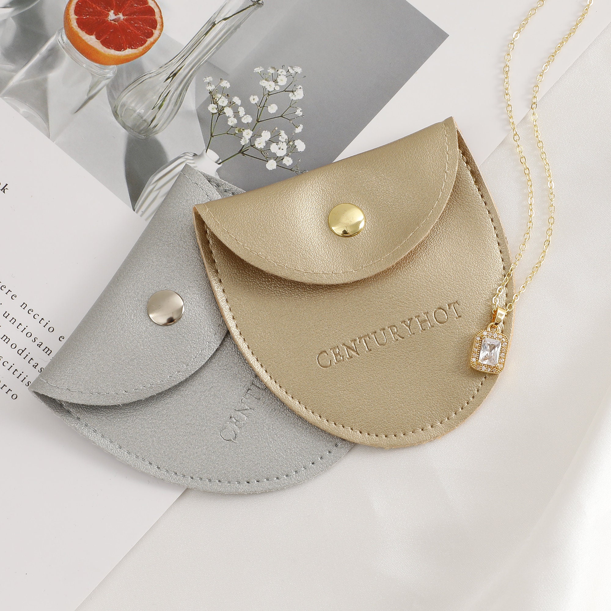 Small jewelry brands solve unmemorable packaging with 50pcs custom embossed logo faux leather bags (from product introduction)