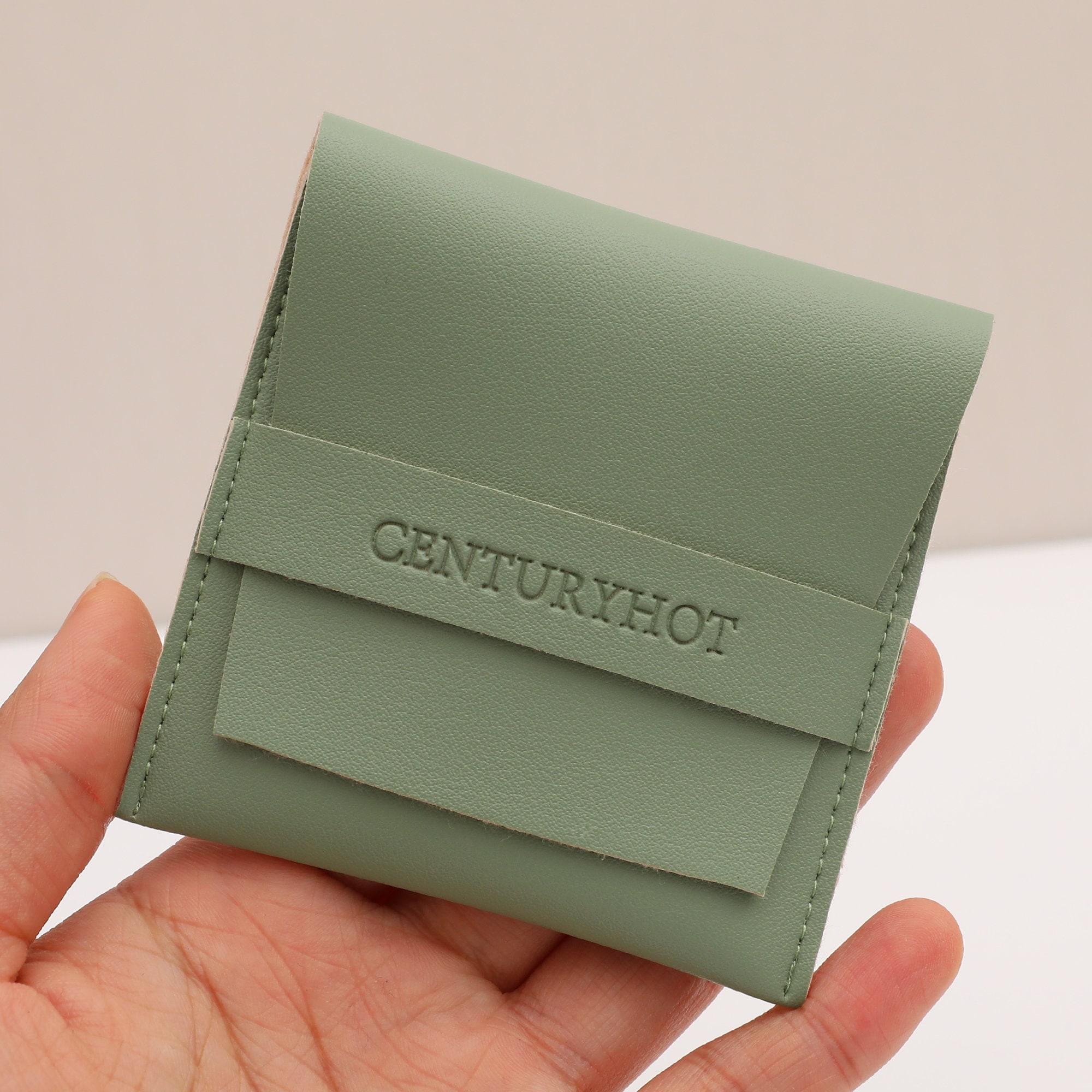 How to Pick Green PU Mini Jewelry Pouches: Custom logo embossing for brand recognition