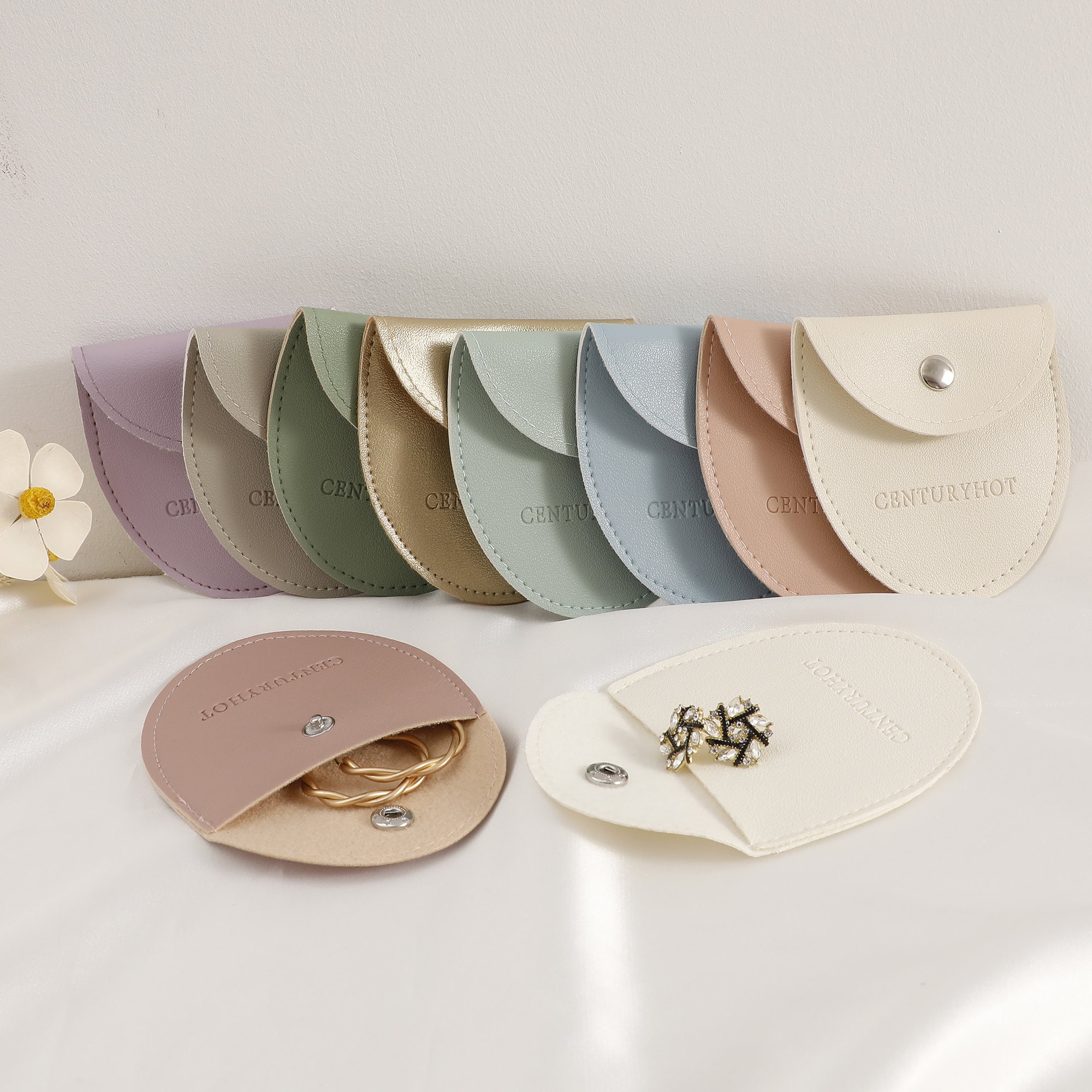 Thick faux leather earring bag with durable stitching, ideal for protecting delicate jewelry during storage and transit