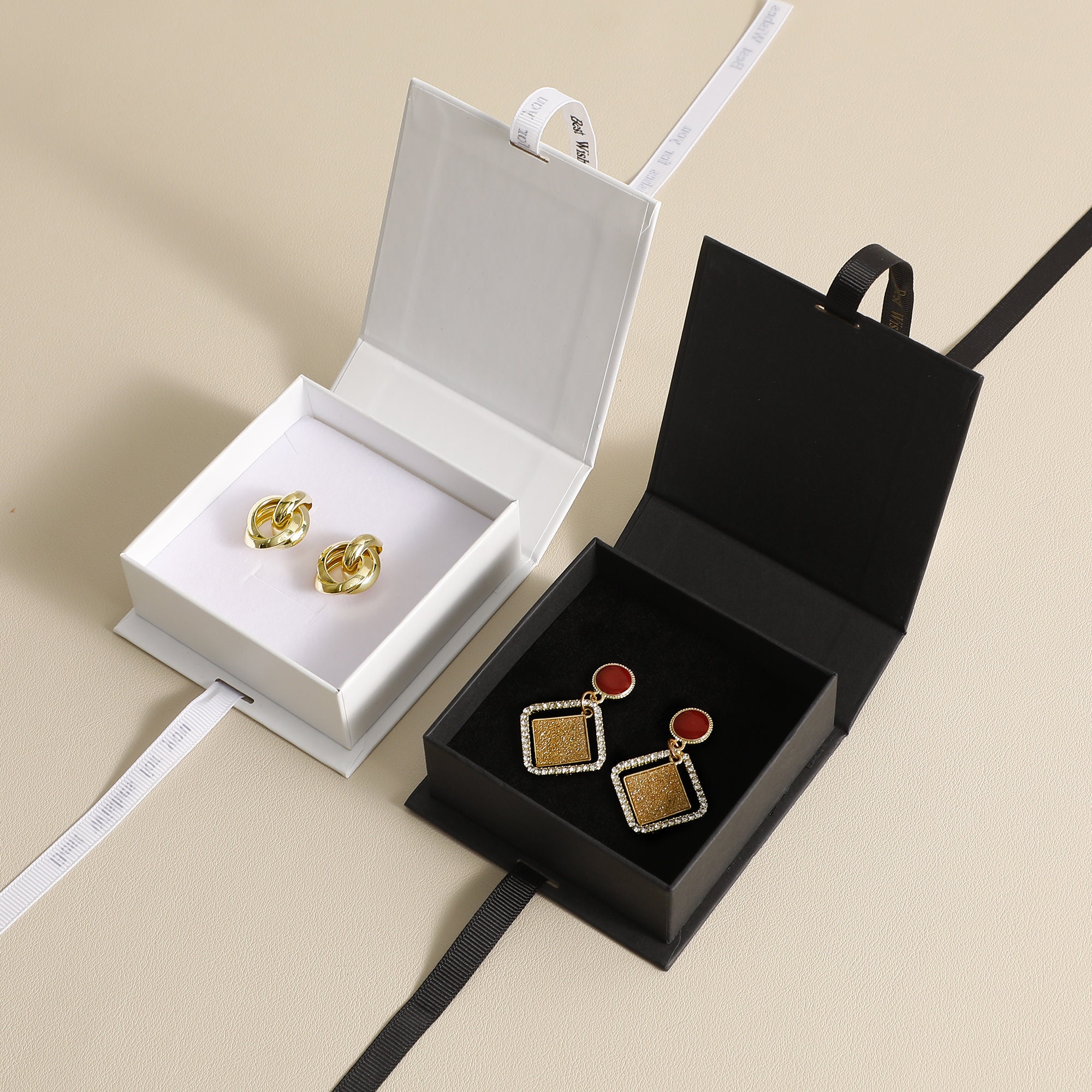 Foam inside flip box with inner size 8.3*8.3*2.8cm, perfect for storing small necklaces and earrings