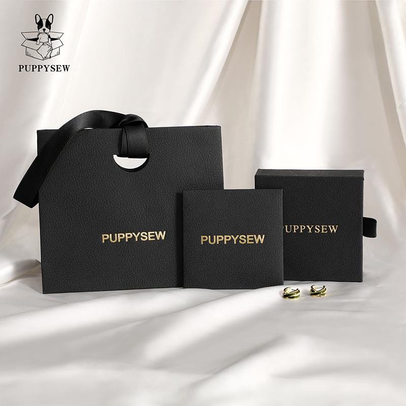 Small jewelry brands solve unmemorable packaging: 50-set custom logo paper box (2000g cardboard) + bag (270g) + cloth (0.4mm microfiber) – 40% repeat buys (from product introduction)