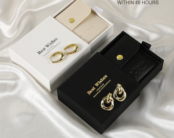 May include: Two small gift boxes with gold earrings inside. The boxes are white and black with the words "Best Wishes" printed on them. The text "Ready to Ship Within 48 Hours" is printed in the top right corner of the image.