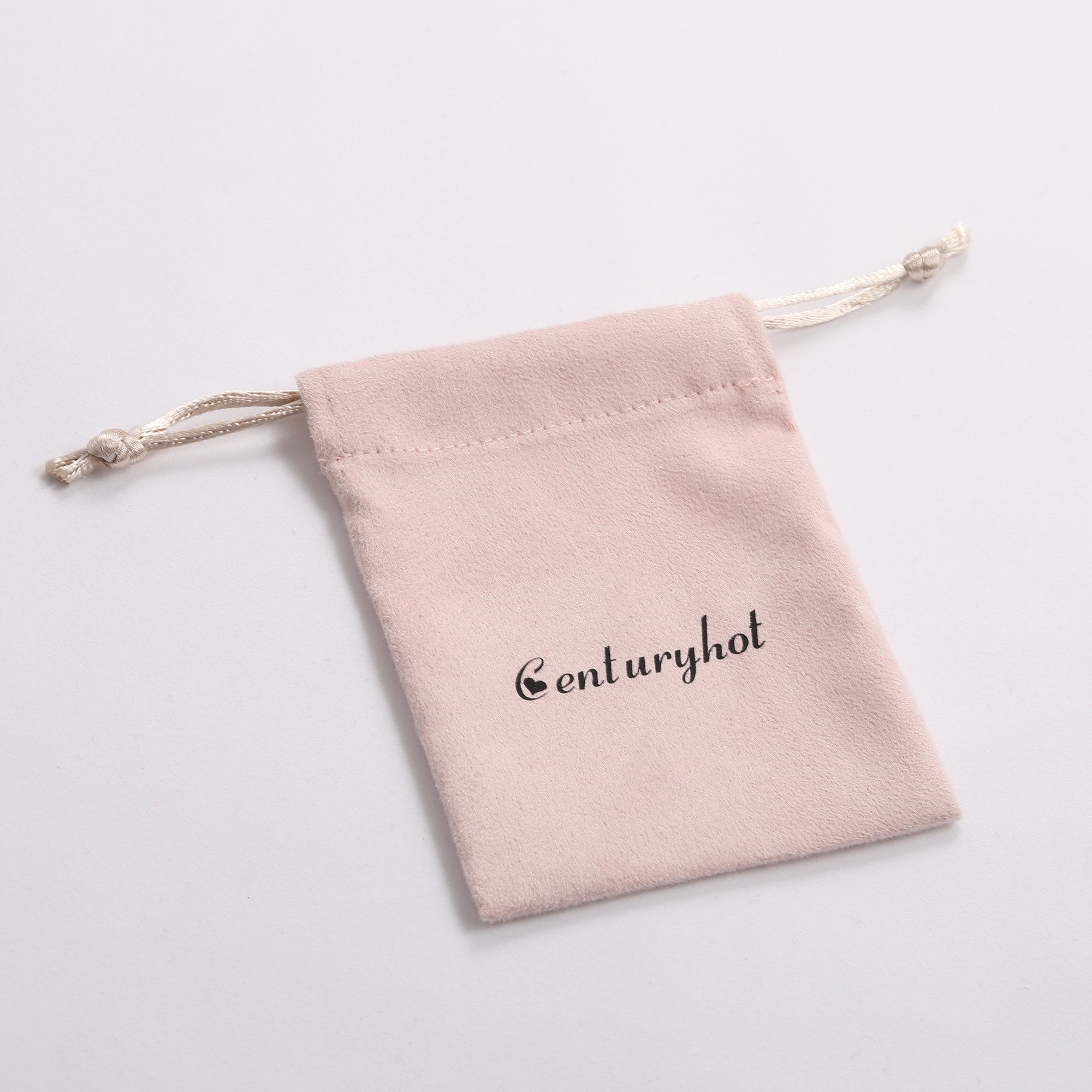 Small jewelry brands avoid generic packaging with custom logo pink drawstring bags (7.5*10.5cm size fits rings/earrings) – 50pcs MOQ cuts waste (from product introduction)