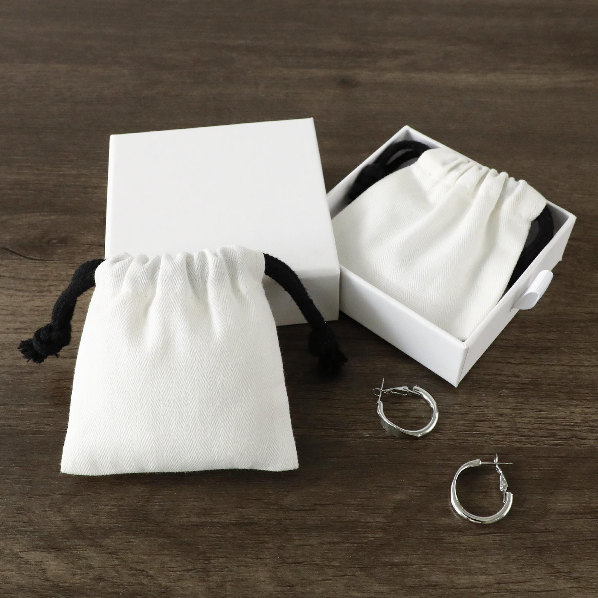 White cotton canvas jewelry pouch showing 230g bamboo canvas texture, ideal for durable jewelry packaging