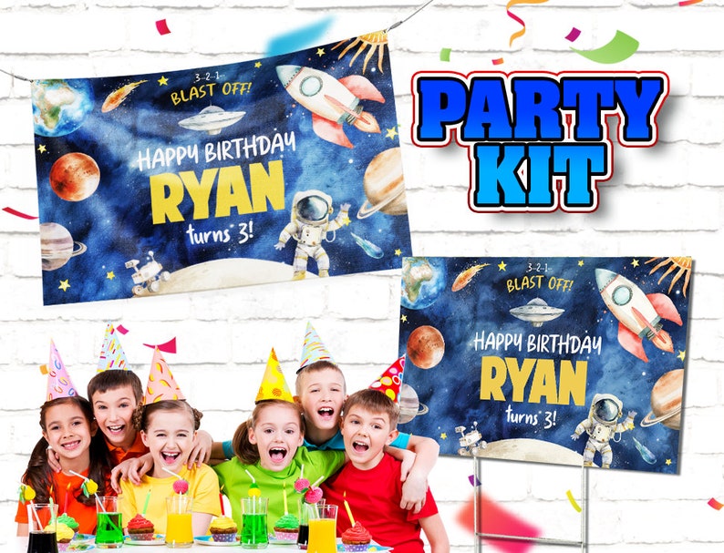 May include: A party kit featuring a blue and white banner and a sign with a space theme. The banner and sign read "Happy Birthday Ryan turns 3!" with a rocket, planets, and stars. 3-2-1 Blast Off! is written on both the banner and sign.