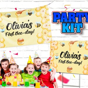 May include: A party kit with a banner and yard sign featuring a bee theme. The banner and sign have a yellow background with honeycomb and bee illustrations. Text reads "Olivia's First Bee-day!" and "Party Kit".