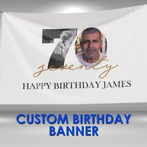 May include: White banner with a photo of a man and the number 70. The banner reads "Seventy" in gold script and "HAPPY BIRTHDAY JAMES" in black. The words "CUSTOM BIRTHDAY BANNER" are in blue.