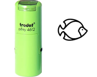 May include: A light green self-inking stamp with the text "trodat printy 4612". A black outline of a fish is next to the stamp. The stamp is designed for creating fish-shaped impressions.