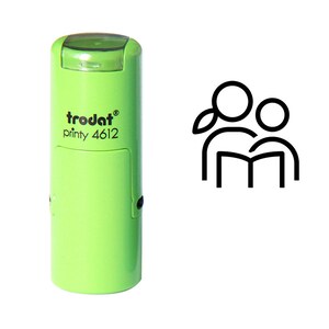 May include: A light green Trodat printy 4612 stamp with a black graphic of two figures reading a book. The stamp has a clear cap and a rectangular ink pad window.