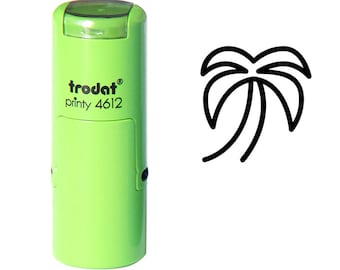 May include: A green Trodat printy 4612 stamp with a black palm tree design. The stamp has a clear plastic cover and is on a white background. The text "trodat printy 4612" is printed on the side of the stamp.