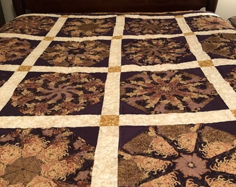 Purple and gold quilt.