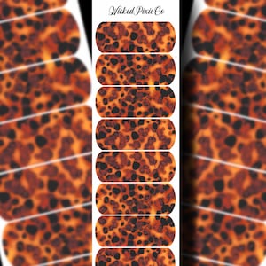 May include: Set of 10 nail wraps with a tortoise shell pattern in shades of orange, brown, and black. The wraps are designed to be applied to fingernails.