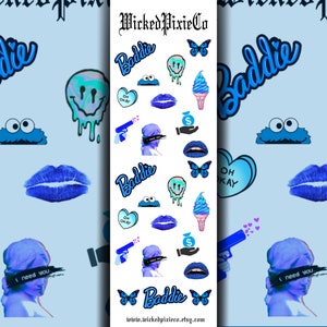 May include: A sheet of blue and white nail stickers with various designs, including a smiley face, a butterfly, a cookie monster, a heart, lips, a gun, a dollar bill, and the word "Baddie".
