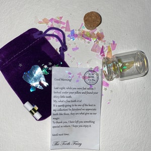 May include: A purple velvet pouch with a drawstring, a small glass bottle with a cork, and a note from the Tooth Fairy. The bottle contains a tooth-shaped charm and glitter. The note reads "Good Morning!" and describes the tooth fairy's visit.