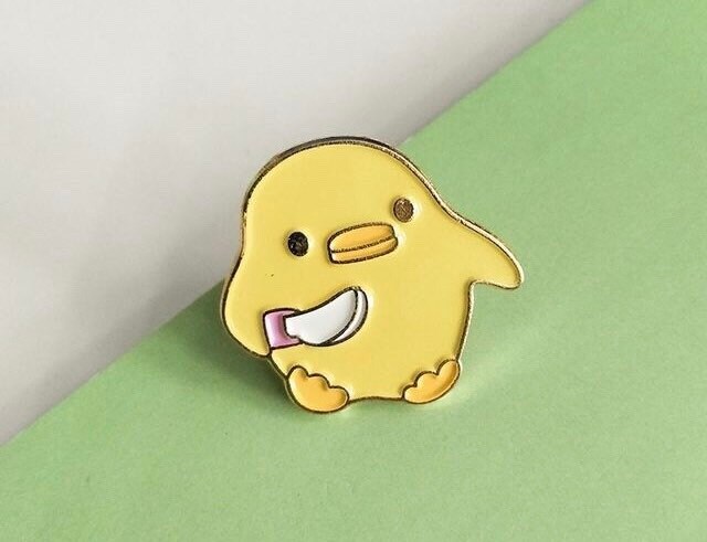 Little yellow duck with knife enamel pin/badge