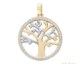 May include: A circular pendant featuring a tree of life design with a gold-toned trunk and silver-toned branches. The outer rim and the tips of the branches are encrusted with small, clear, sparkling stones. The word LUXO is printed in the bottom right.