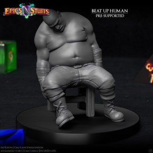 May include: A gray 3D printed miniature of a large, overweight human figure sitting on a stool. The figure has a tired expression and is wearing pants and boots. The miniature is pre-supported and is part of a set called "Beat Up Human".