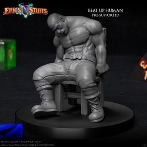 May include: Gray 3D printed miniature of a muscular human figure sitting on a chair. The figure has a mustache and is wearing pants and boots. The miniature is pre-supported and is titled "Beat Up Human".