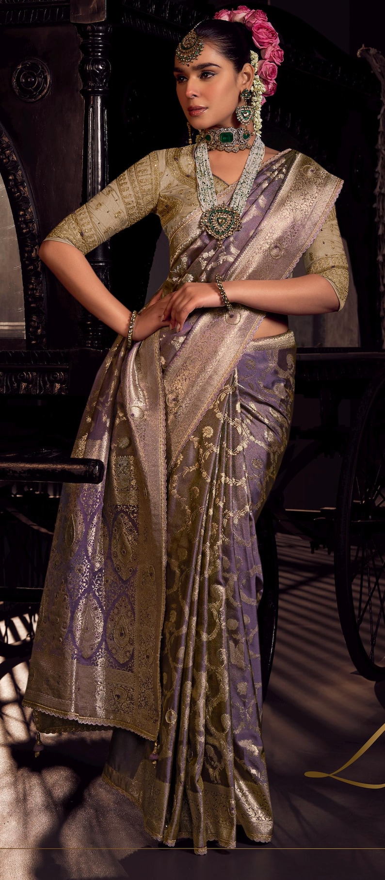 May include: A luxurious purple and gold sari with intricate paisley patterns. The sari features a detailed gold border and is draped elegantly. The image showcases the rich texture and design of the traditional Indian garment.