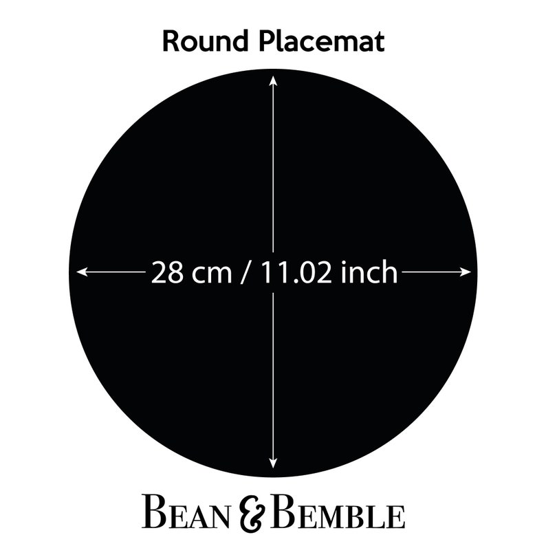 May include: Round black placemat with the text "Round Placemat" and "BEAN & BEMBLE" printed on it. The placemat measures 28 cm / 11.02 inches in diameter.
