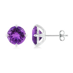 May include: A pair of stud earrings featuring round, faceted purple amethyst gemstones. The gemstones are set in a silver metal with a four-prong setting. One earring is shown from the side, displaying the post and butterfly backing.