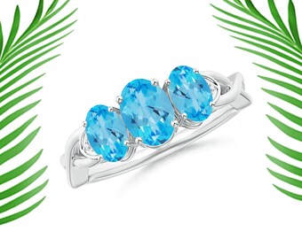 Swiss Blue Topaz Sterling Silver Ring: Three Stone Criss-Cross Design