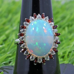 Ethiopian Opal Ring: Sterling Silver Solitaire with Garnet & Topaz