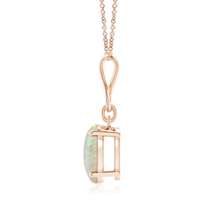 May include: A delicate rose gold pendant necklace featuring a white opal gemstone. The opal is set in a simple, elegant prong setting.