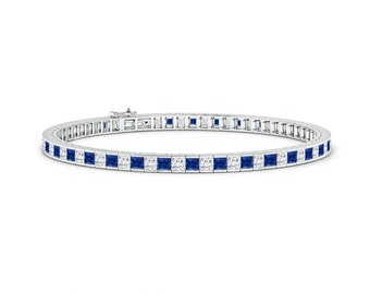 May include: A silver tennis bracelet featuring a row of square-shaped blue sapphires and smaller clear diamonds.