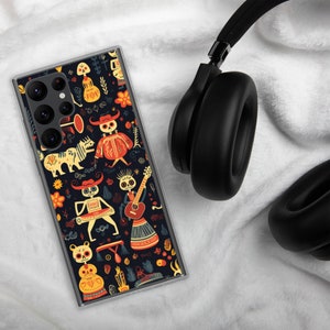 May include: A clear phone case with a colourful design featuring skeletons playing musical instruments. The design is inspired by the Day of the Dead celebration.