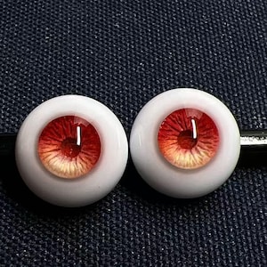 May include: A white ceramic mug with a black handle and the text "But first, coffee" in a black, handwritten-style font. The mug is on a white surface.