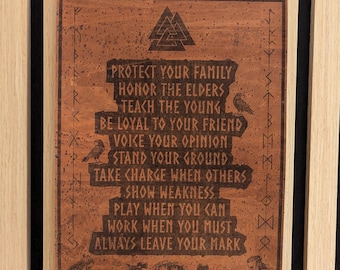 May include: A rectangular brown wooden wall hanging featuring a laser-engraved Valknut symbol at the top, flanked by two ravens. The text reads: PROTECT YOUR FAMILY, HONOR THE ELDERS, TEACH THE YOUNG, BE LOYAL TO YOUR FRIEND, VOICE YOUR OPINION, STAND YOUR GROUND, TAKE CHARGE WHEN OTHERS SHOW WEAKNESS, PLAY WHEN YOU CAN, WORK WHEN YOU MUST, ALWAYS LEAVE YOUR MARK. The bottom displays two seated figures and a shield with two axes.