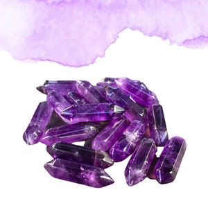 May include: A group of amethyst crystal points in various sizes and shapes. The crystals are a deep purple color and have a smooth, polished finish.