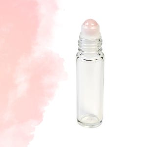 May include: A white ceramic mug with a black handle and the text "But First, Coffee" in a black, handwritten-style font. The mug is on a white surface.