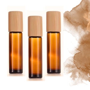 Frascos con tapa de bambú en formato roll-on de ámbar (individual o en juego) de 10 o 5 ml (de vidrio) y opción de piedra preciosa, acero inoxidable o vidrio.