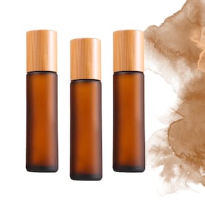 Frascos con tapa de bambú en ámbar esmerilado (individual o en juego) de 10 ml o 5 ml de vidrio. Su elección de piedra preciosa, acero inoxidable o bola de vidrio.