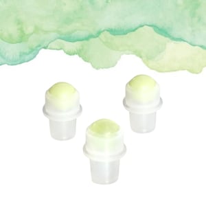 May include: Three small, clear plastic containers with rounded, light green tops. The containers are set against a white background, with a watercolour wash of green hues in the upper portion of the image.