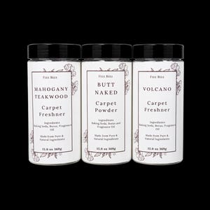 May include: Three cylindrical containers with black lids, each featuring a white label with floral illustrations. The labels are printed with the text Fizz Bizz, product names Mahogany Teakwood, Butt Naked, and Volcano, and 13.0 oz 368g weight.